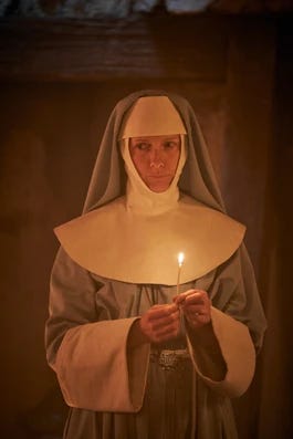 This is an image of Agatha Van helsing holding a lighter. Agatha Van Helsing is a Catholic nun who fights Dracula with wit and defiance in the 2020 BBC adaptation of Dracula. Agatha Van Helsing was a character who inspired Salome, the heroine of Hanna Delaney's religious horror gothic mystery of the same name. Salome is a novice nun who must join a clandestine order in 1880s Liverpool where she becomes a vampire slayer and demonologist.